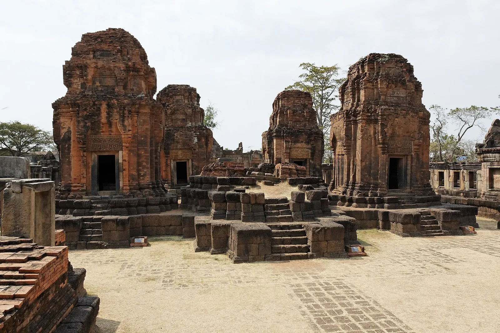 The brick towers of Prasat Muang Tam on a laterite platform