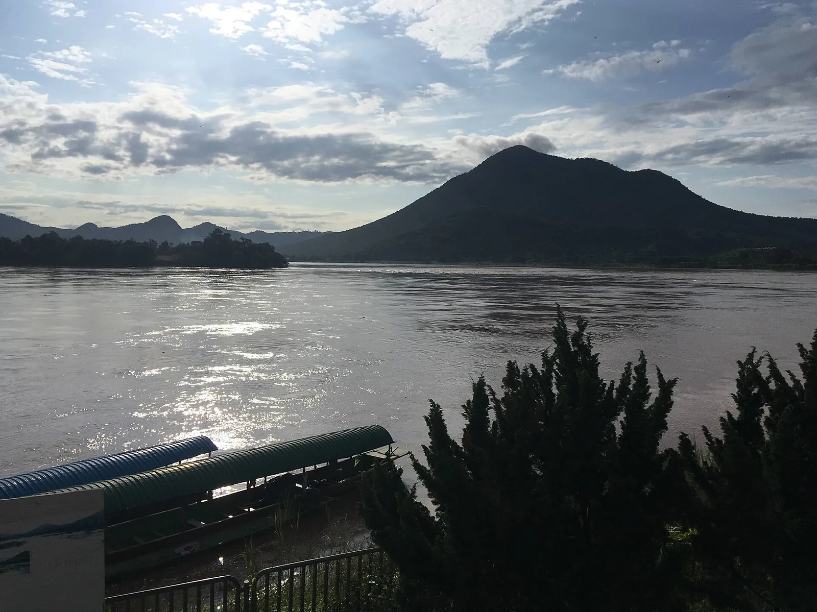 The Mekong at Kaeng Khut Khu with a mountain rising on the far bank in Laos