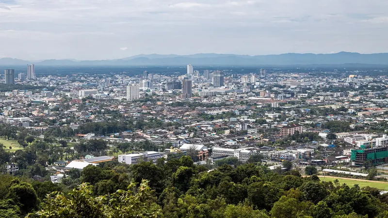 The skyline of Hat Yai city spreading across the plain with hills beyond