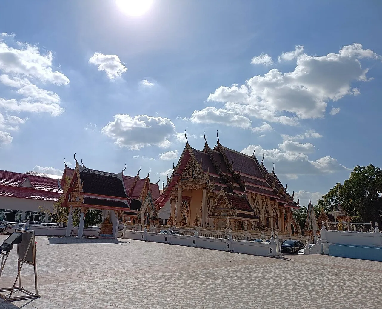 The ordination hall of Wat Klang in Khon Kaen with tiered red and gold roofs