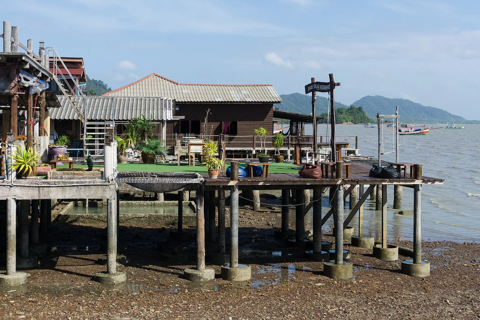 Old wooden houses on stilts over the water at Lanta Old Town