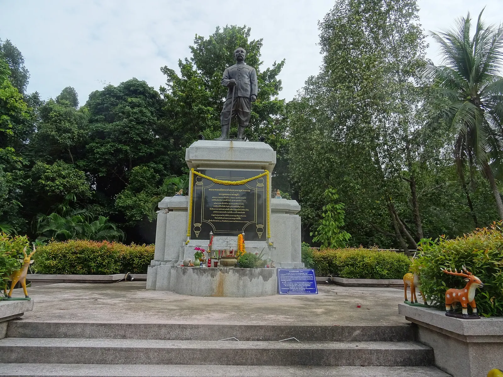 A statue of King Rama V on a plinth near Than Sadet waterfall