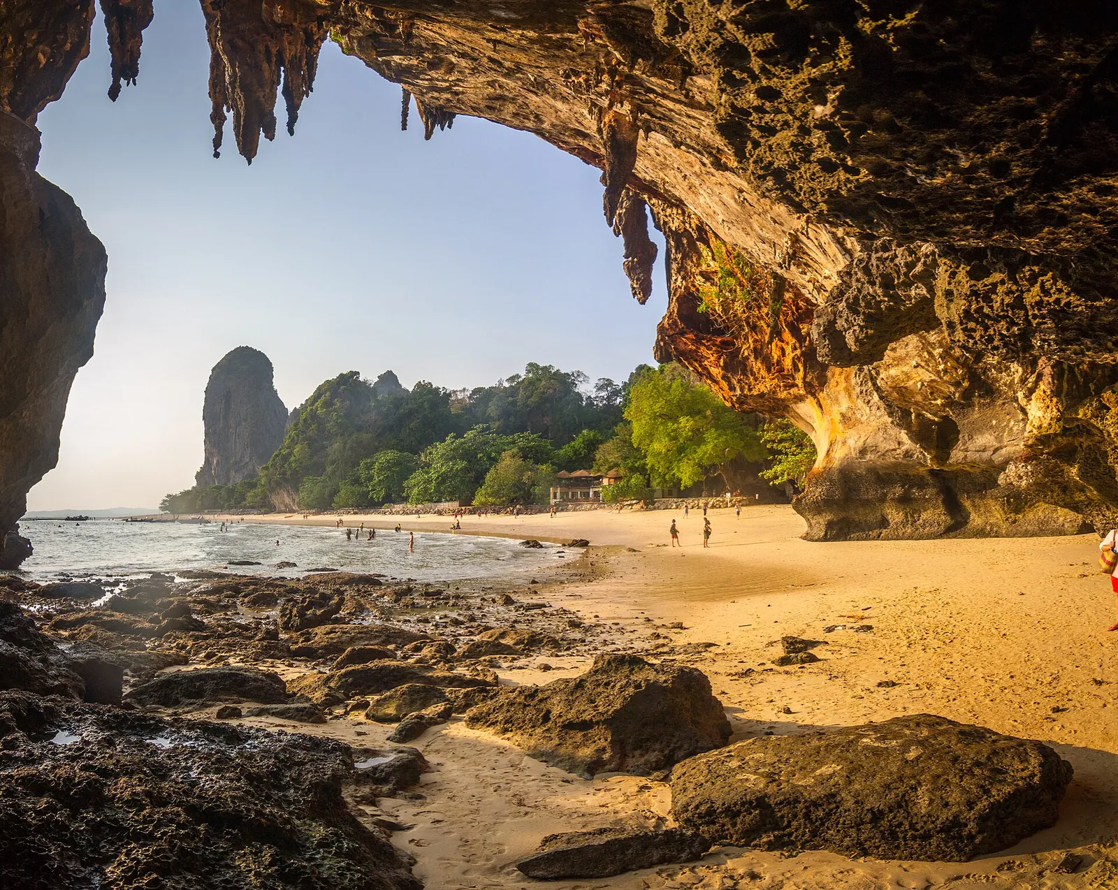 Phra Nang beach framed by an overhanging limestone cave with a rock island offshore