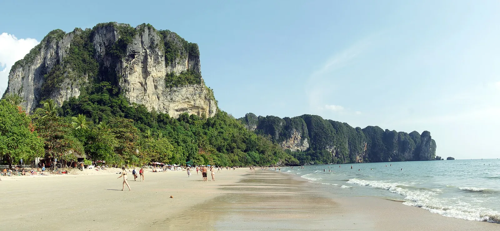 The long sweep of Ao Nang beach below a limestone headland