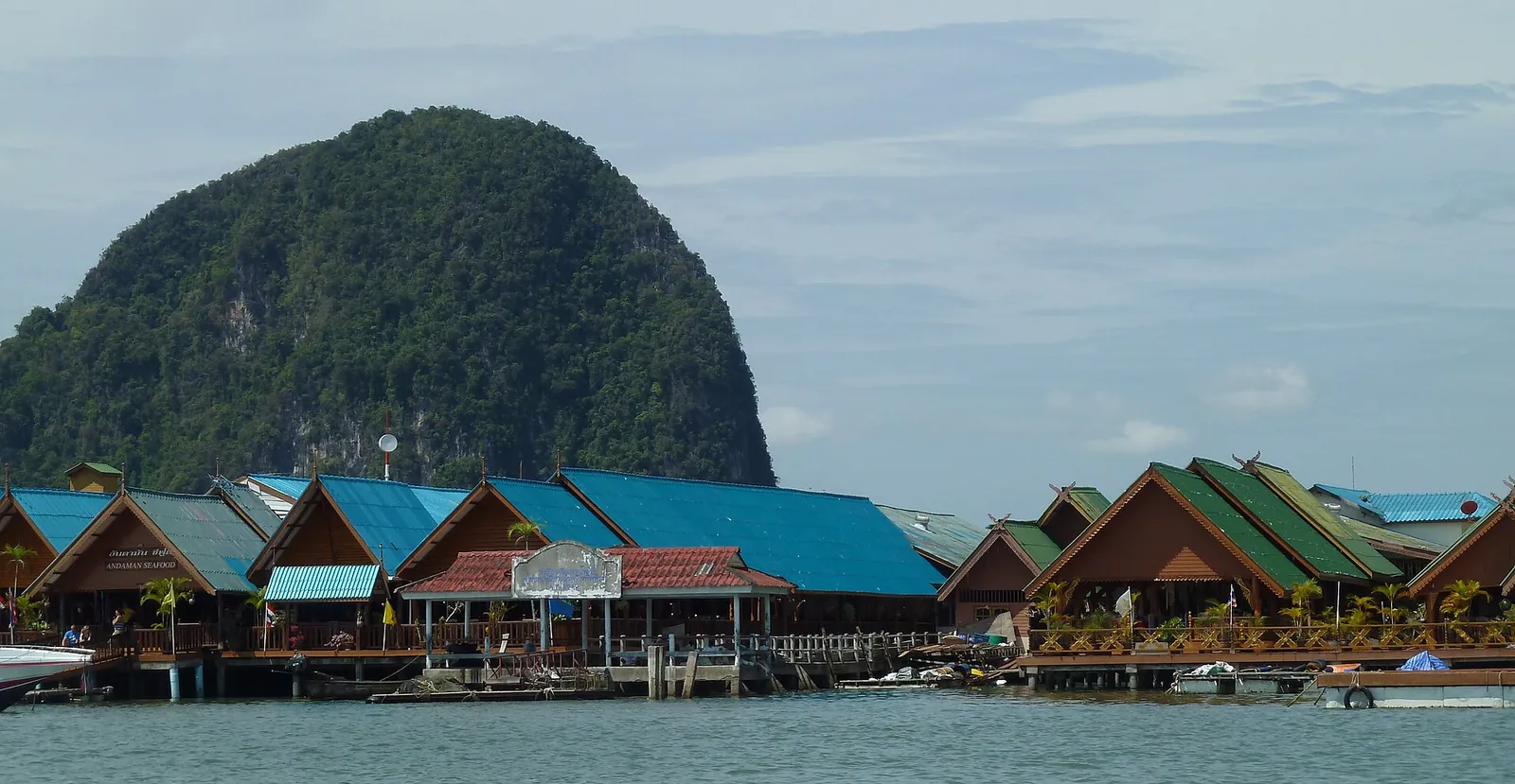 The stilt houses and mosque of Koh Panyi village beneath a limestone cliff