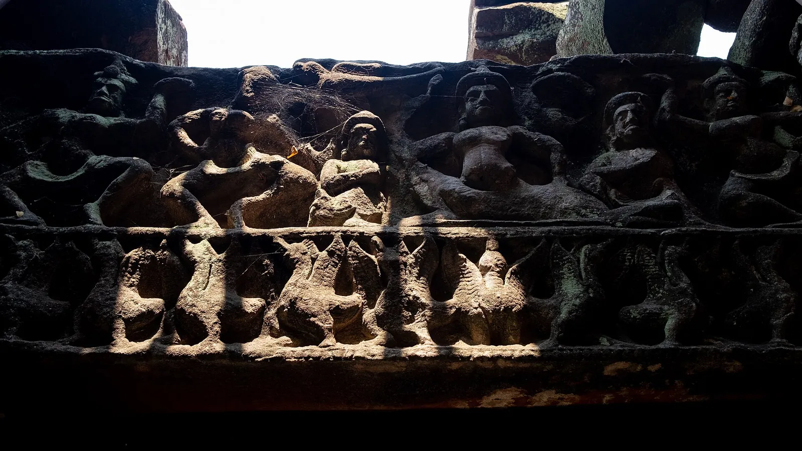 A carved sandstone lintel with rows of figures inside the inner enclosure of Phimai