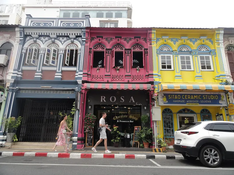 Colourful restored Sino-Portuguese shophouses in pink, yellow and blue in Phuket Old Town