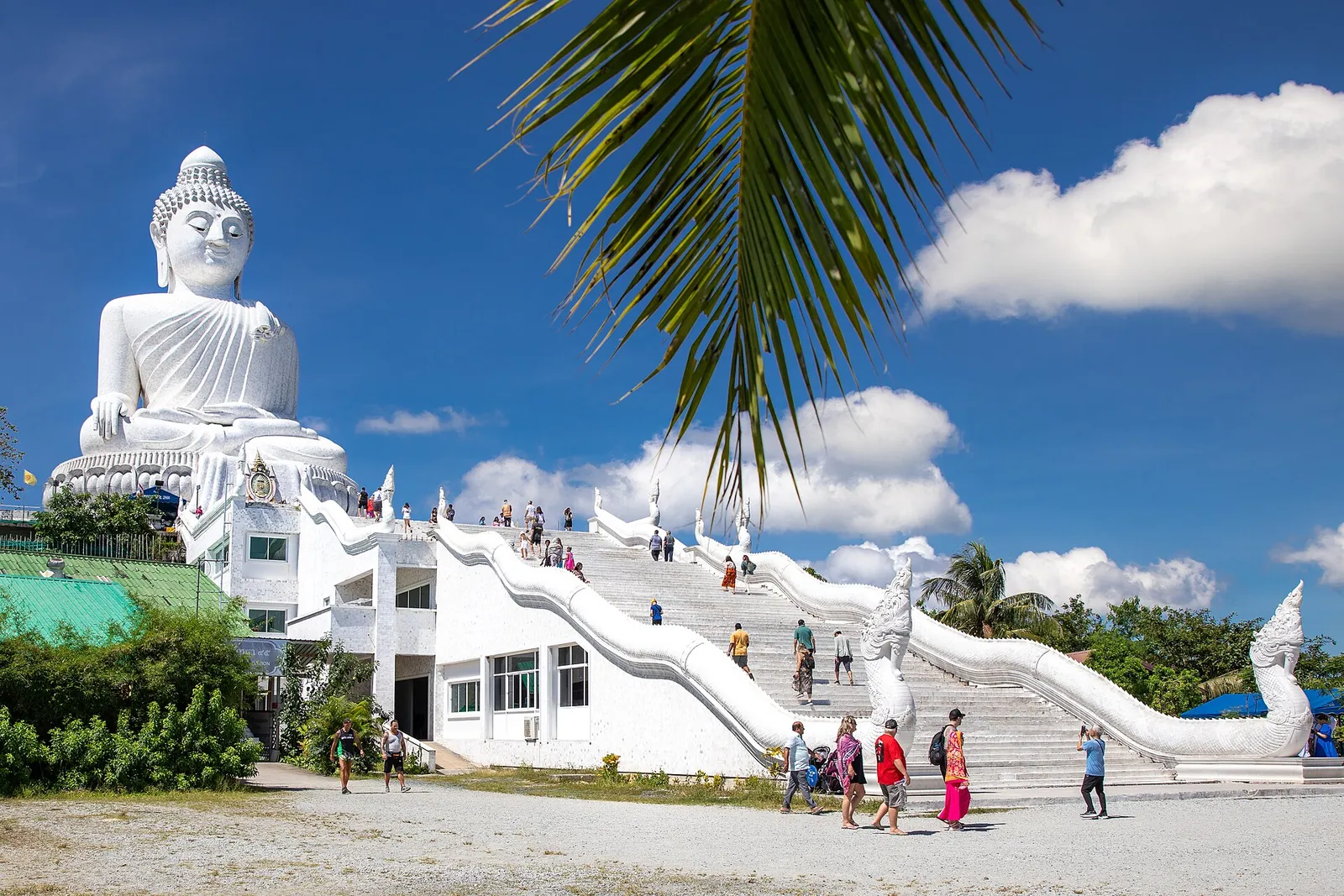 The white marble Big Buddha above a white naga staircase on the Nakkerd hills