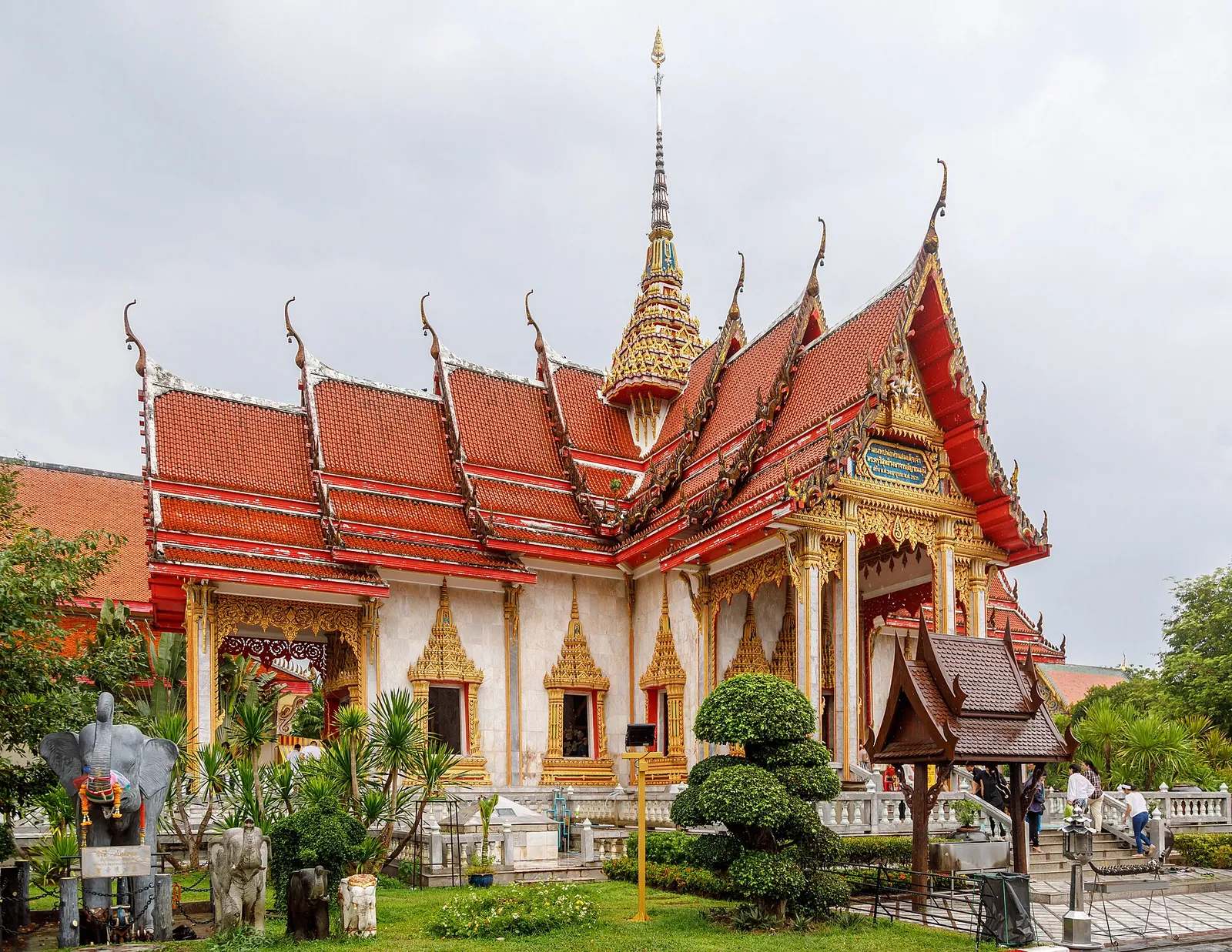 The ornate tiered roofs of the main hall at Wat Chalong