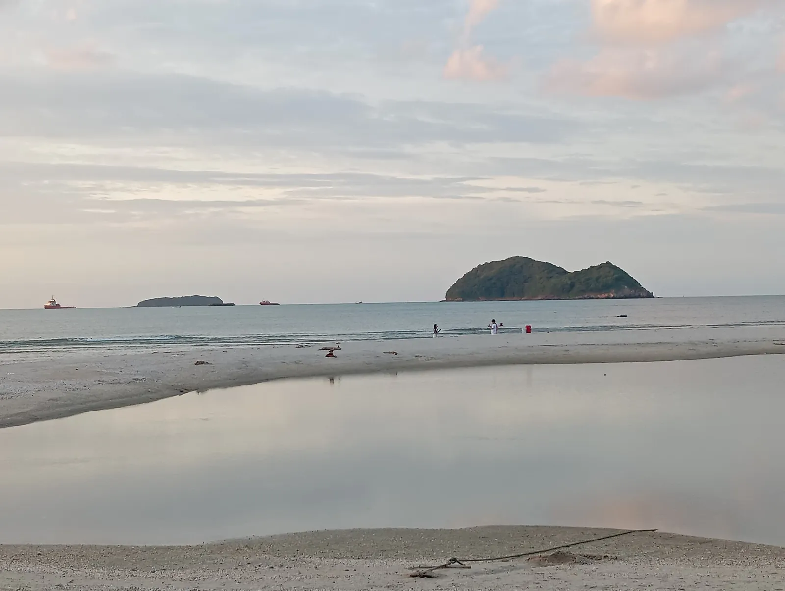 Ko Nu island seen across calm water from Samila beach