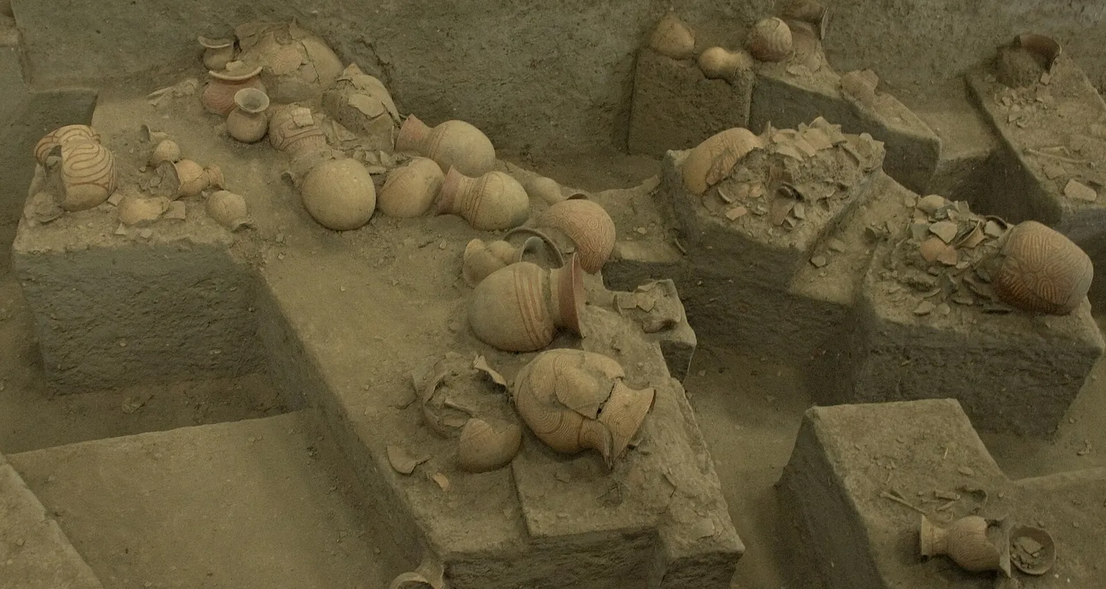 Pottery and remains exposed in an excavation pit at the Ban Chiang archaeological site