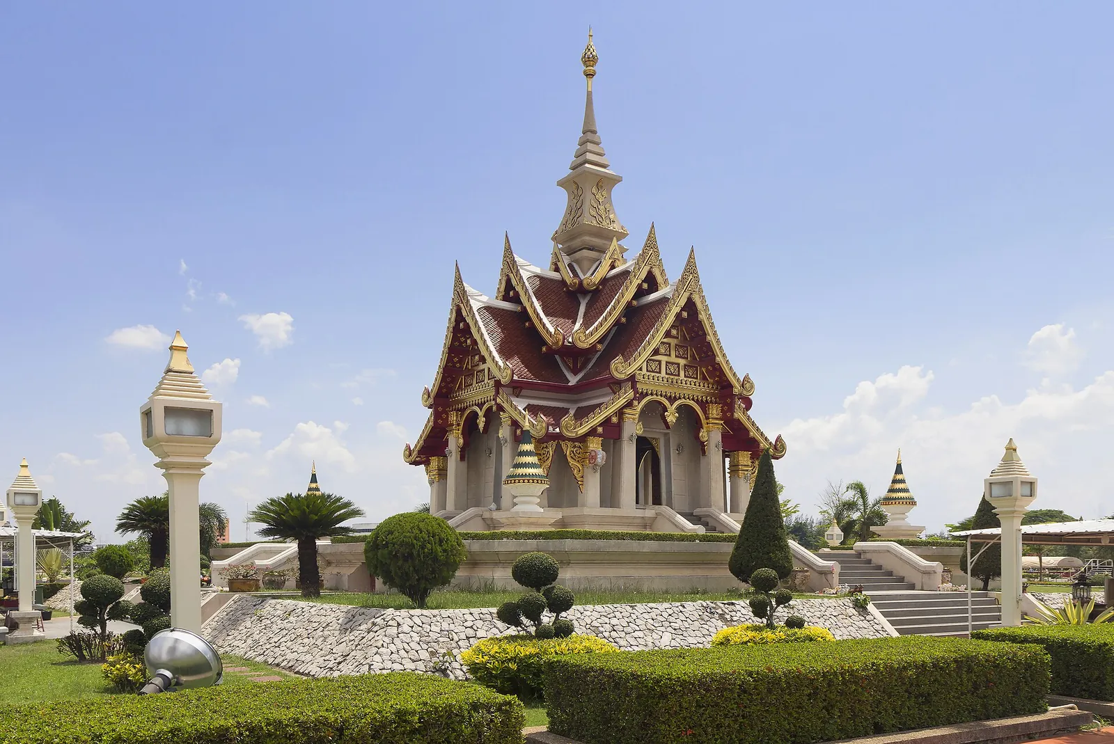 Udon Thani's city pillar shrine with an ornate spire in a landscaped garden