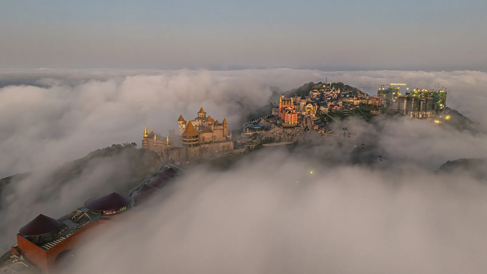Sun World Ba Na Hills on its summit emerging from a sea of clouds at dawn