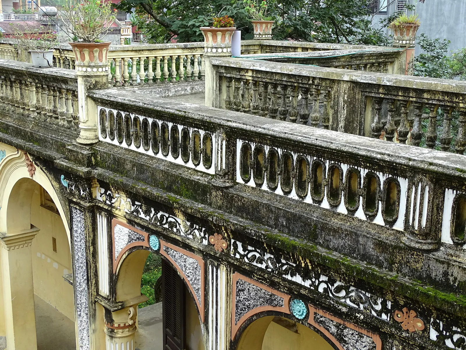 Balustraded terraces and arched doorways of the Hoang A Tuong Palace in Bac Ha