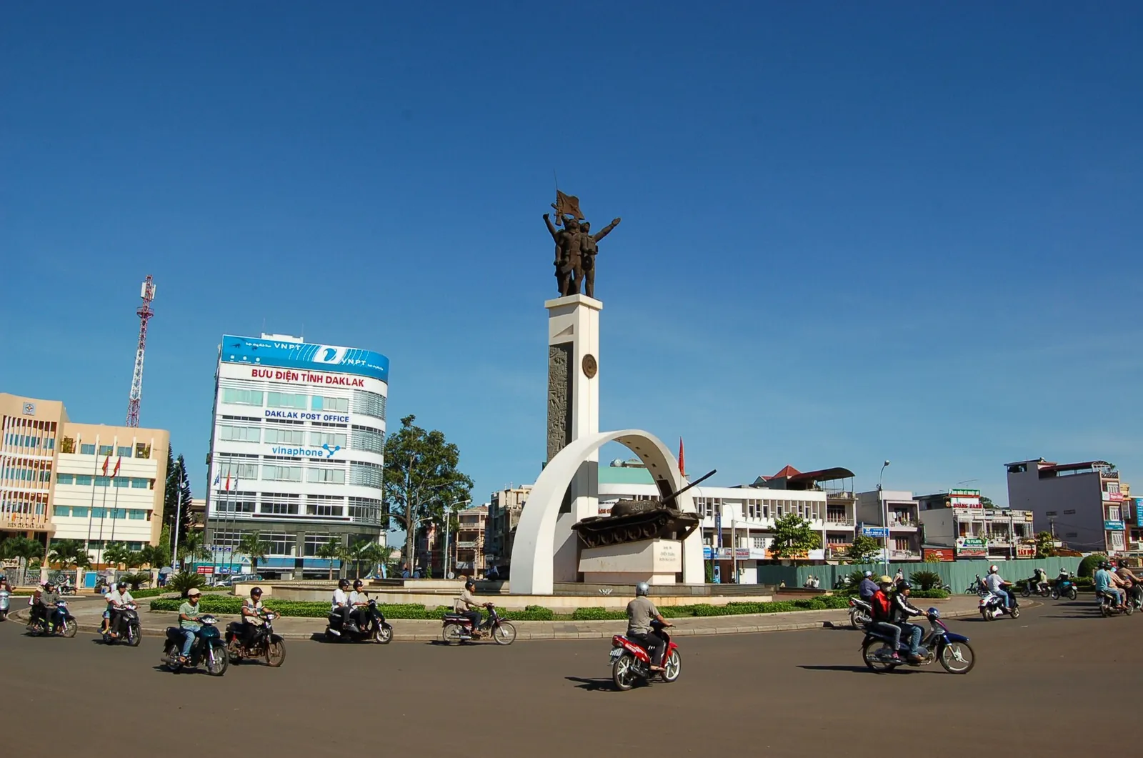 Victory Monument at the Nga Sau intersection in central Buon Ma Thuot with motorbikes on the roundabout