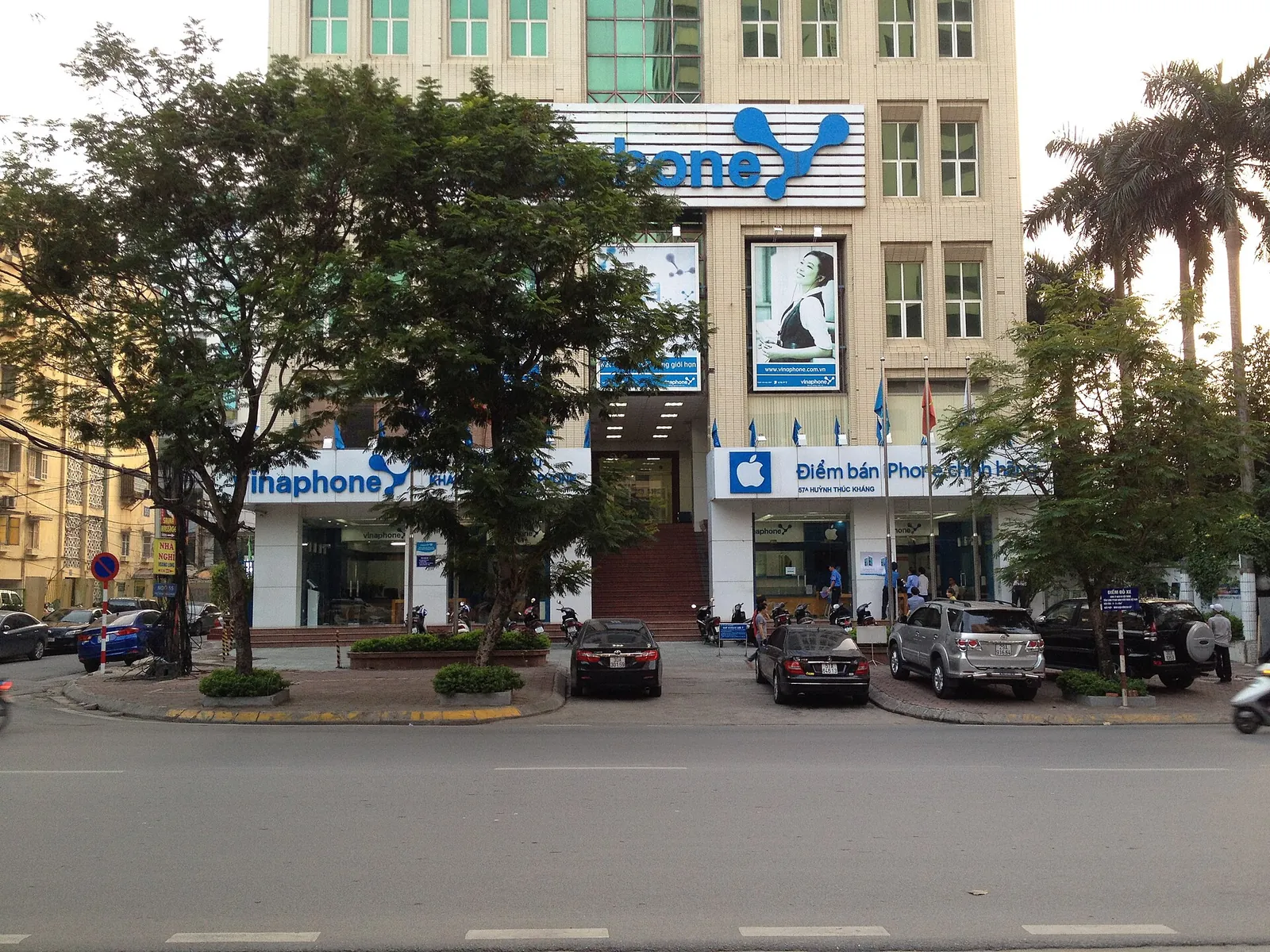 VinaPhone shop front on Huynh Thuc Khang street in Hanoi, with an office building above