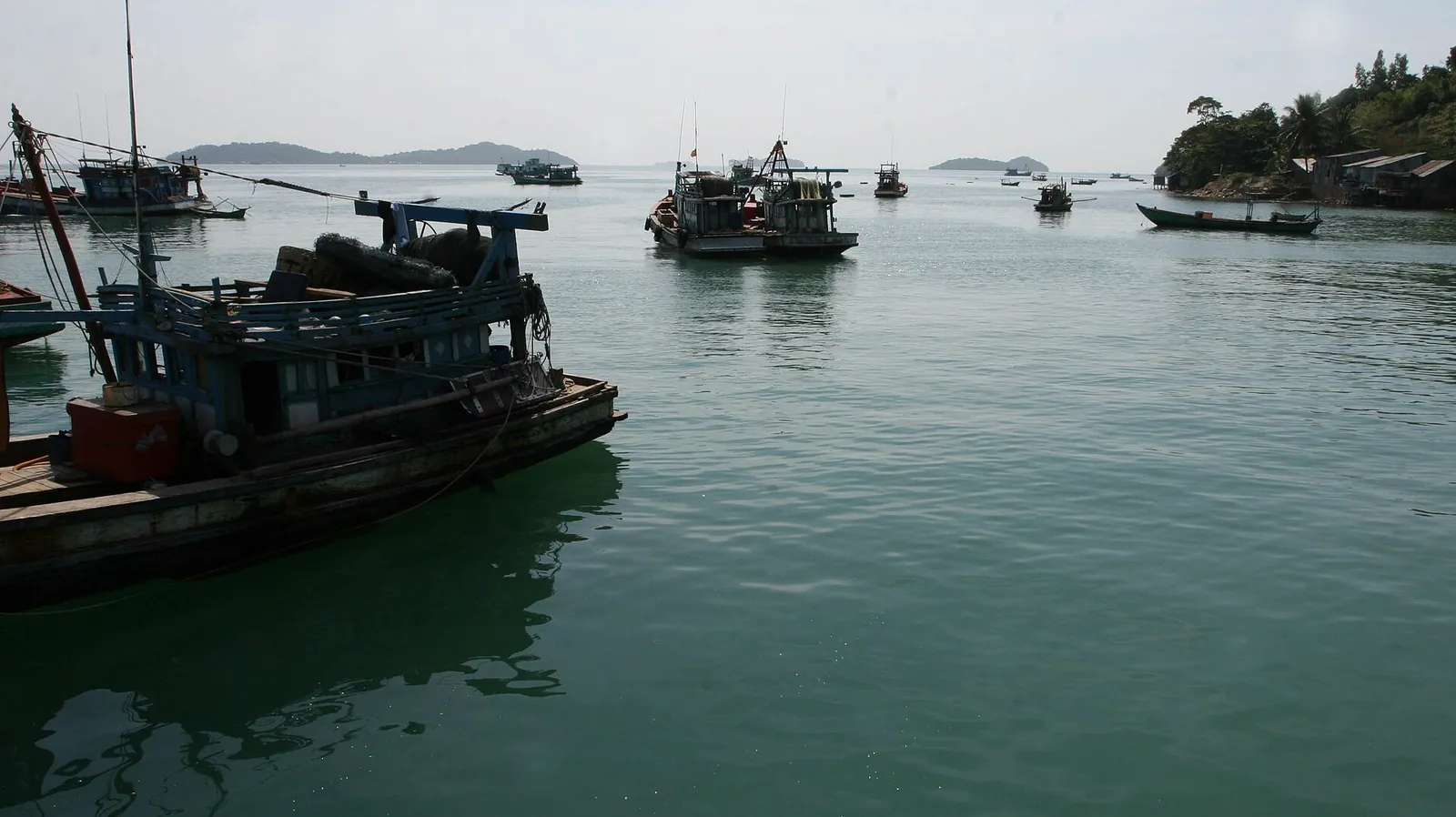Fishing boats moored in a sheltered anchorage among the islands off Ha Tien