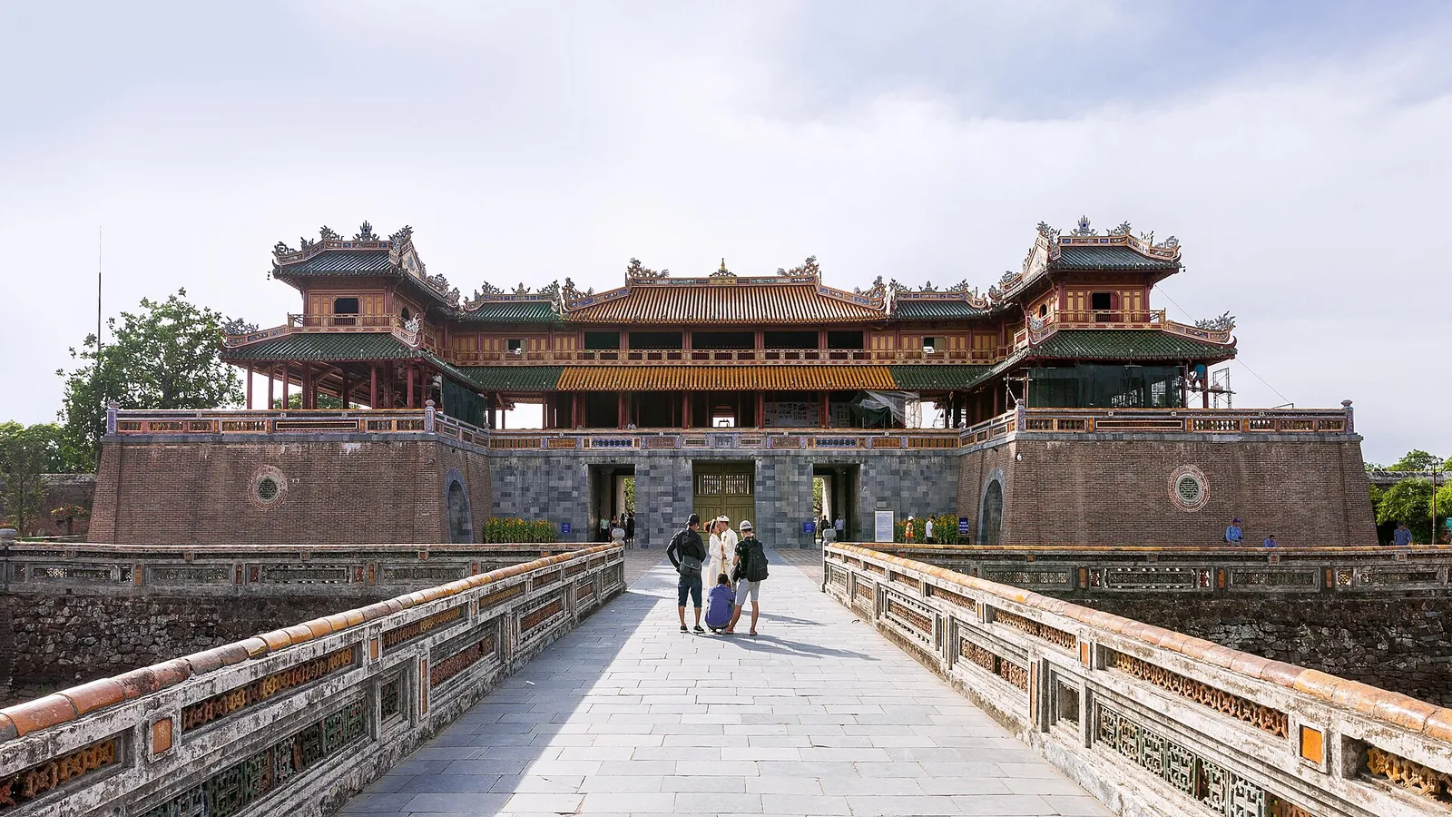The Ngo Mon (Meridian) Gate of the Hue Imperial City seen across its stone bridge under a bright sky