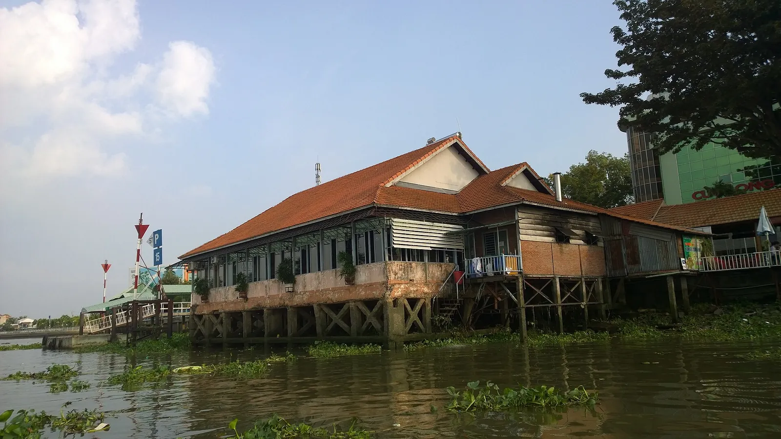 A long tiled house on stilts over the water on An Binh island, Vinh Long