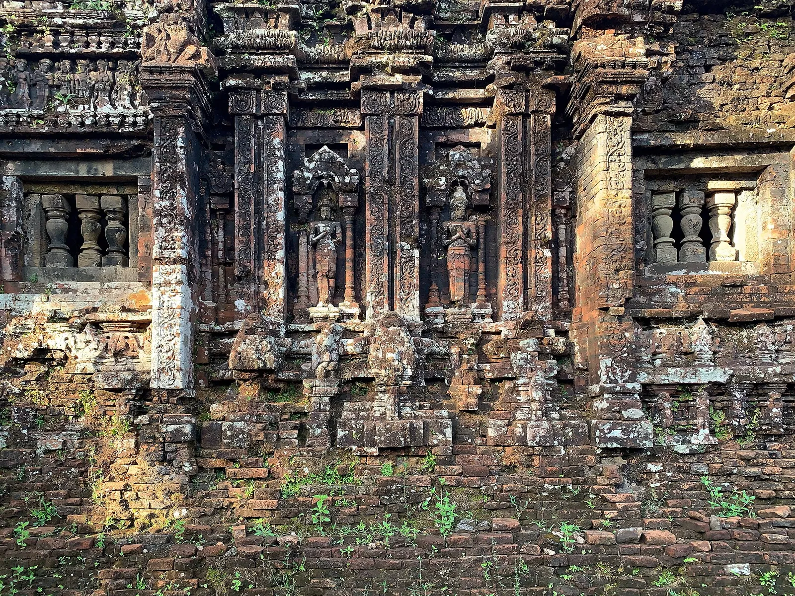 Close-up of carved brick and sandstone decoration on a Cham tower wall at My Son