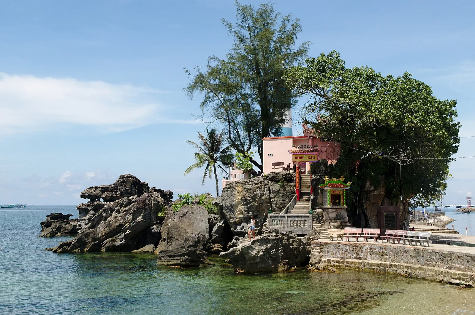 Dinh Cau shrine on a rocky outcrop surrounded by sea and trees at Duong Dong, Phu Quoc