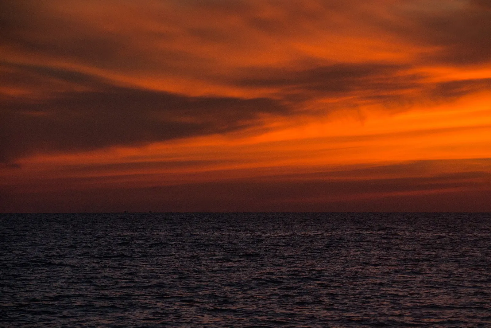 Orange sunset sky over the calm sea at Long Beach on Phu Quoc's west coast