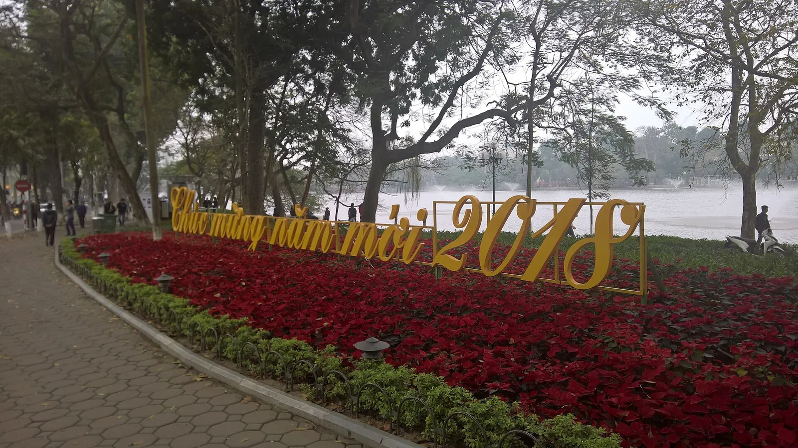 A flower bed spelling out a New Year greeting for 2018 beside Hoan Kiem Lake in Hanoi