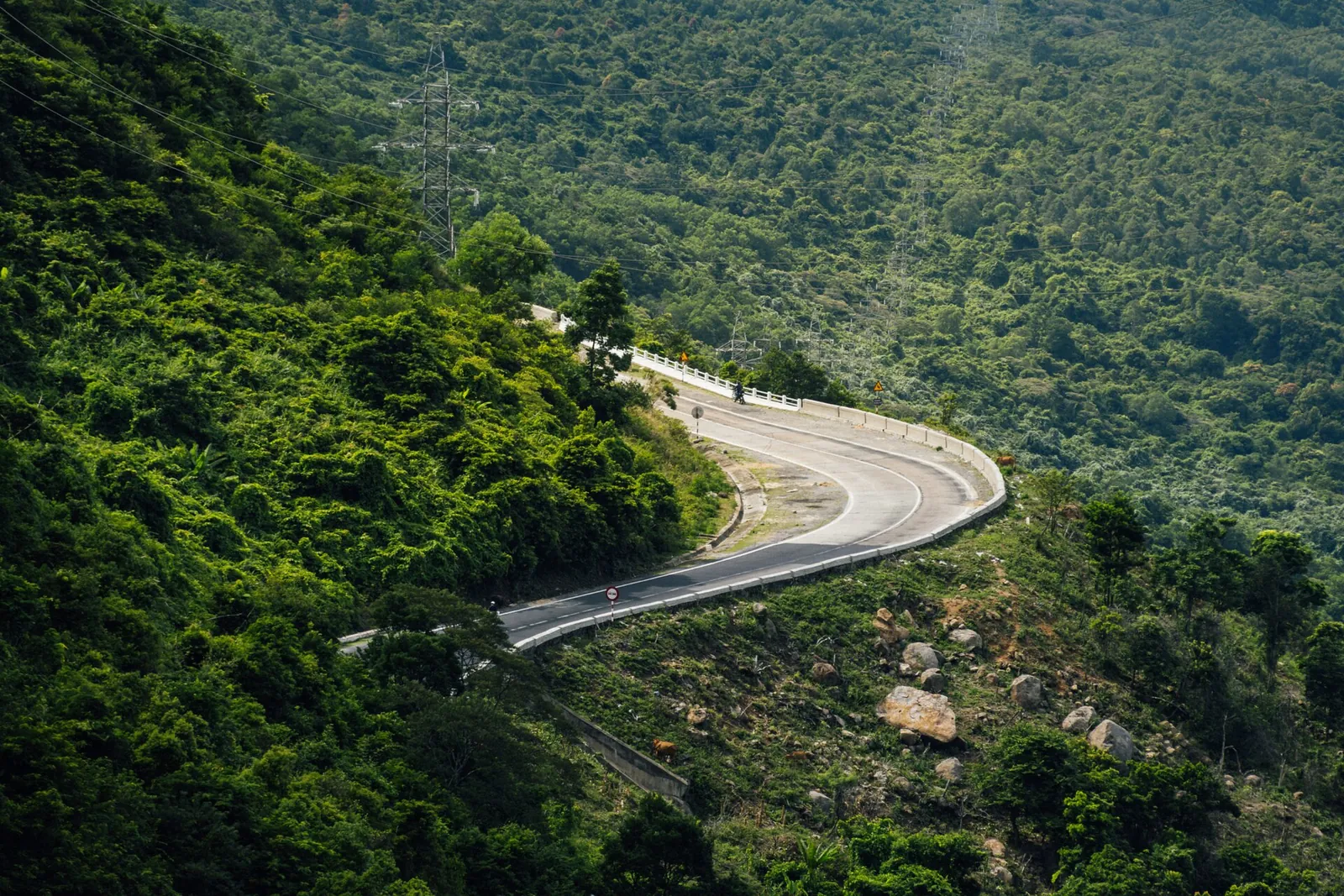 The Hai Van Pass road winding through forested hills