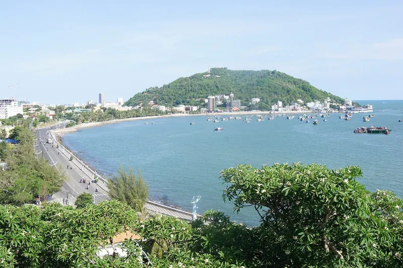 The curve of Front Beach and the Vung Tau waterfront below Small Mountain, seen from the slope of Big Mountain