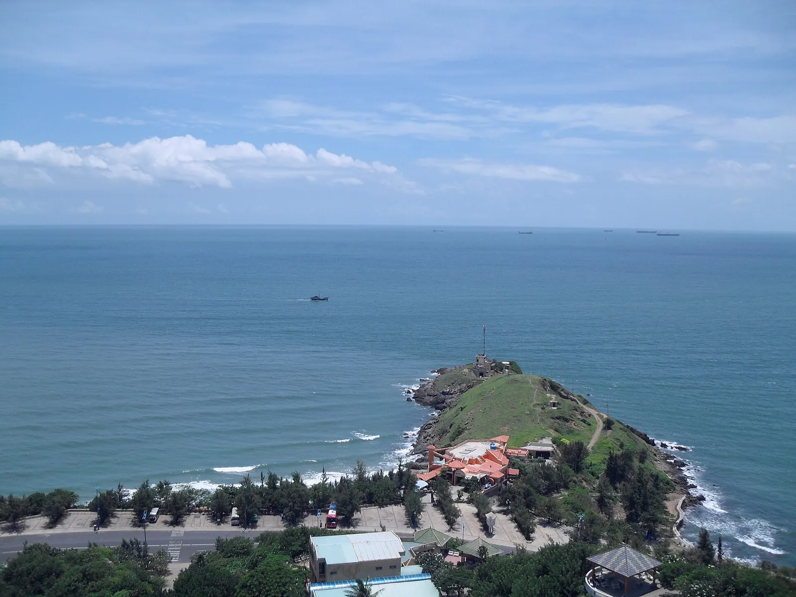 View down from Small Mountain over the green tip of Nghinh Phong Cape and the sea